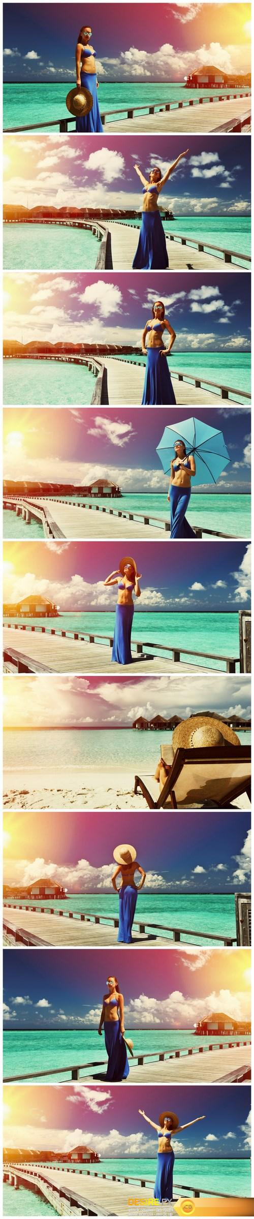 Woman on a beach jetty at Maldives - 9xUHQ JPEG Photo Stock