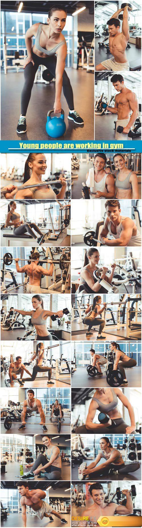 Attractive young people are working in gym