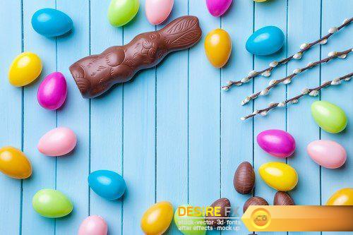 Chocolate easter eggs and sweets on wooden background 29X JPEG