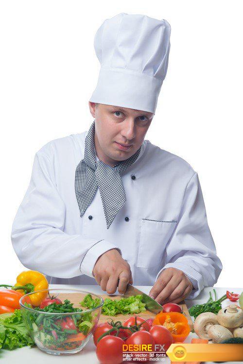 Chef cuts the greens at a table with vegetables 4X JPEG