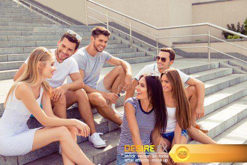 Group of diverse successful young  boyfriends and girlfriends having fun at summertime
