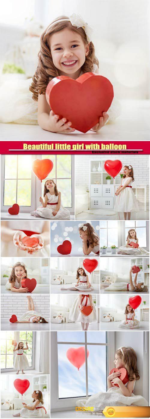Beautiful little girl with balloon in the form of heart