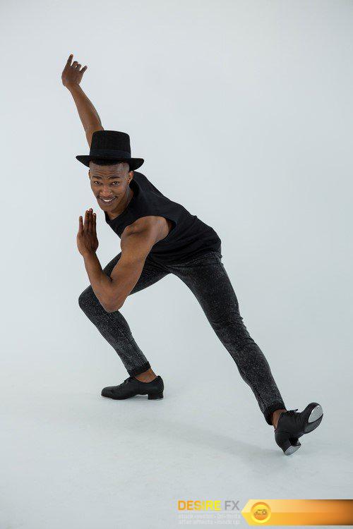 Dark-skinned young man dancing and stretching 12X JPEG