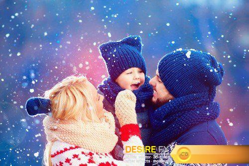 Happy family having fun under winter snow 7X JPEG