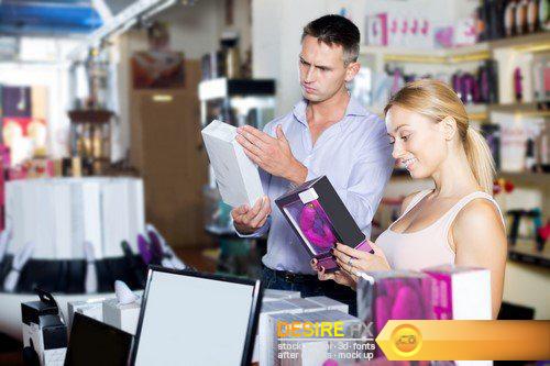 Man and woman choosing sexual accessories in sex shop 17X JPEG