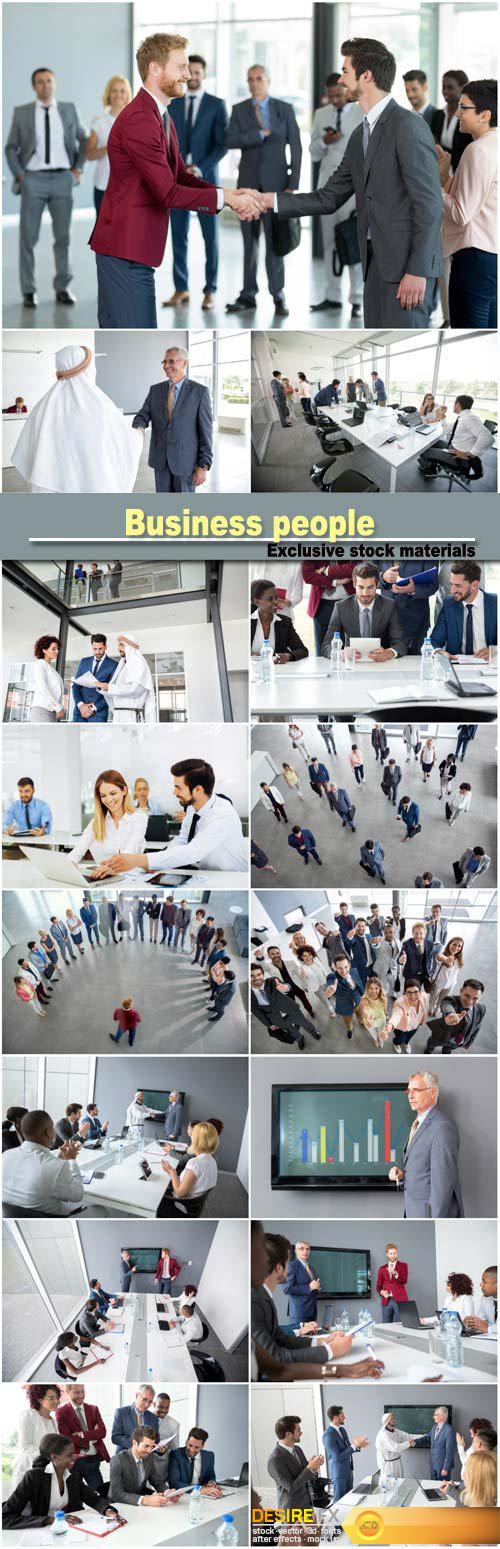 Business partners handshaking, successful adult business people