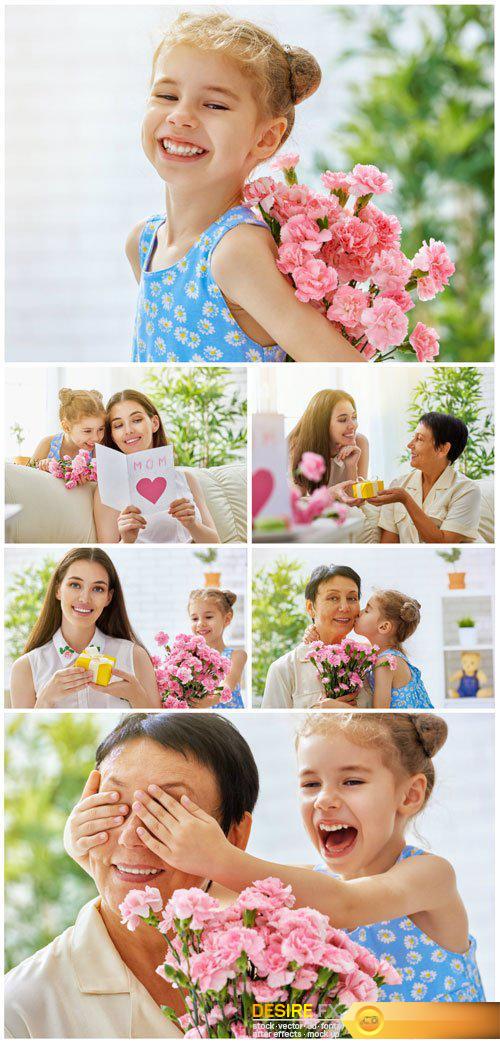 Happy mother and daughter with a bouquet of flowers