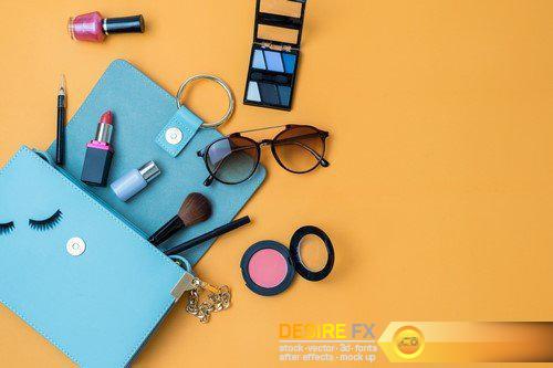 Women handbag with makeup and accessories isolated on pink background 20X JPEG