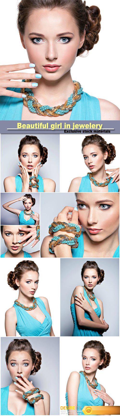 Beautiful girl in blue dress and jewelery
