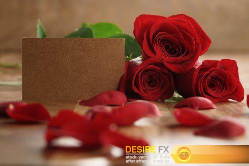 Red roses and petals on old wood table with 8 march paper card 18X JPEG