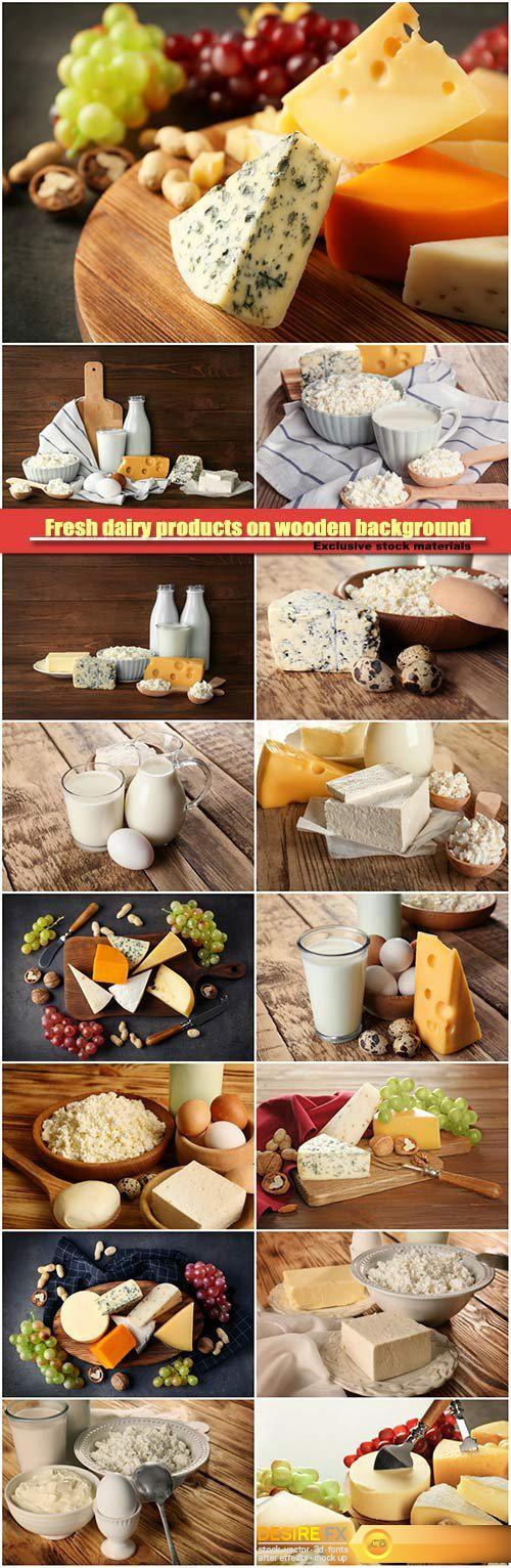 Fresh dairy products on wooden background, cheese and nuts