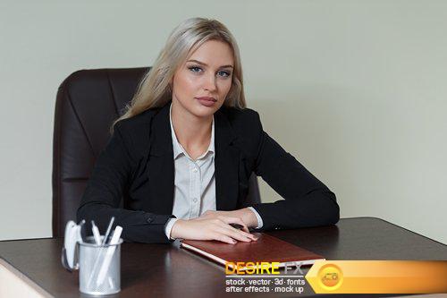 Beautiful businesswoman in suit sitting at the table - 10 UHQ JPEG