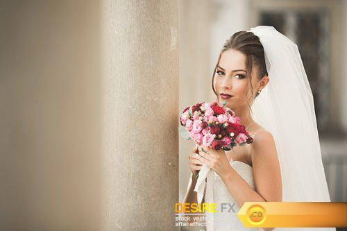 Beautiful bride with wedding bouquet posing in old city - 17 UHQ JPEG