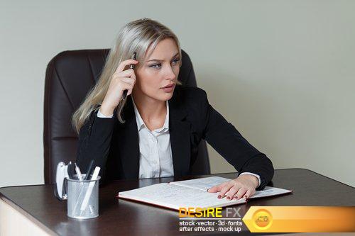 Beautiful businesswoman in suit sitting at the table - 10 UHQ JPEG