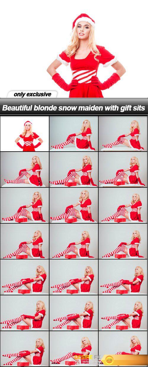 Beautiful blonde snow maiden with gift sits - 21 UHQ JPEG