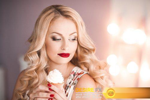 Beautiful blonde girl holding cake over lights background - 8 UHQ JPEG