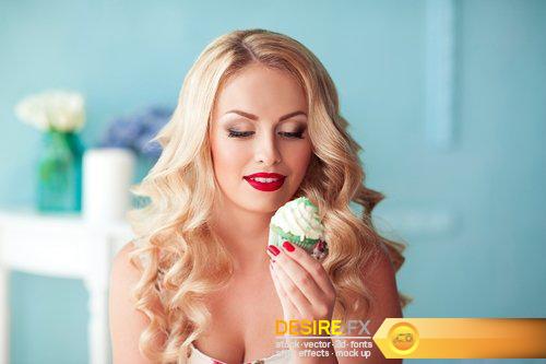Beautiful blonde girl holding cake over lights background - 8 UHQ JPEG