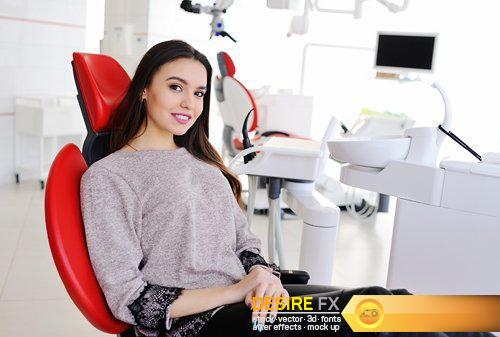 Attractive girl in red dental chair at the reception - 9 UHQ JPEG