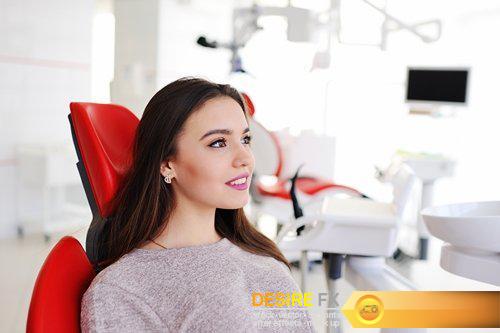 Attractive girl in red dental chair at the reception - 9 UHQ JPEG