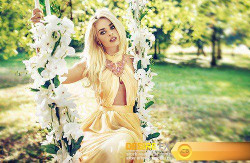 Attractive blonde beauty on a flower swing in a park - 8 UHQ JPEG