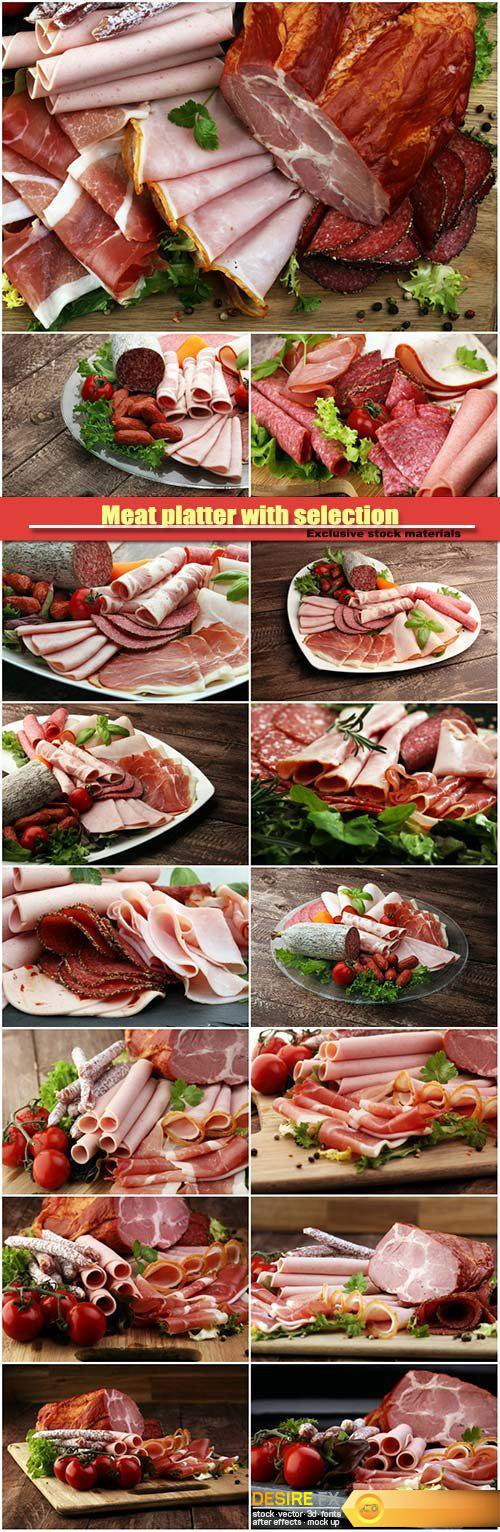 Meat platter with selection, salami, pieces of sliced ham, sausage, tomatoes, salad and vegetable