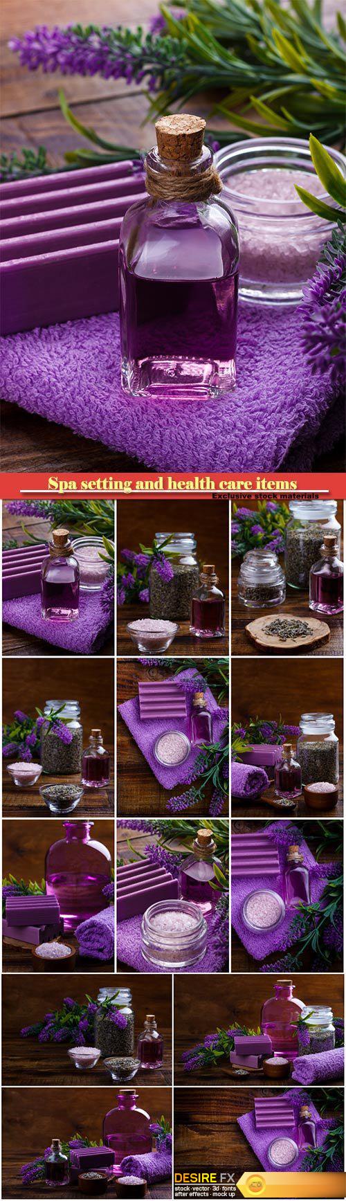 Spa setting and health care items, lavender handmade soap, body oil, bath salt, towel, on wooden board