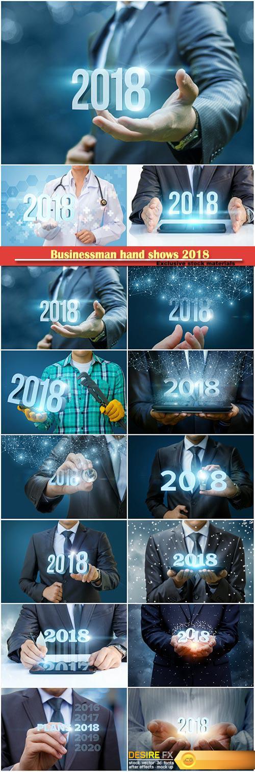 Businessman hand shows 2018, concept of a new year